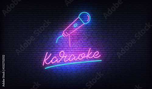 Karaoke neon billboard. Neon sign with microphone and Karaoke lettering photo