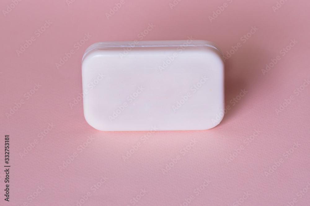 Soap bar in foam with copy space in center isolated on bright pink background. Soap bar in foam with copy space in center isolated on bright pink background.