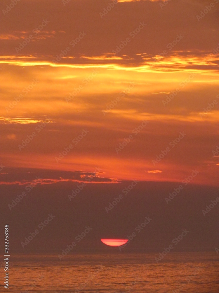 Watching the multicolored summer sunset