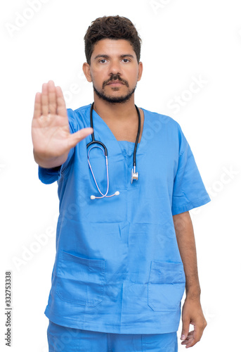 Hispanic male nurse with beard gesturing stop for distance