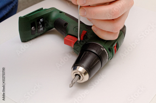 Engineer begins repairing a broken screwdriver.