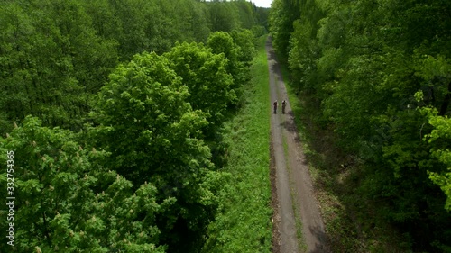 aerial of mountain bikers cycling along a trail photo