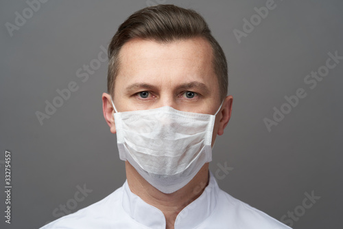 Doctor Man wearing hygienic mask to prevent infection. © Gecko Studio