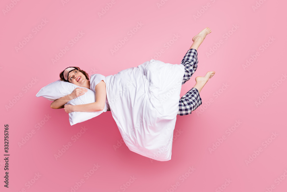 Full size photo of cheerful lady satisfied morning nap lying bed hug