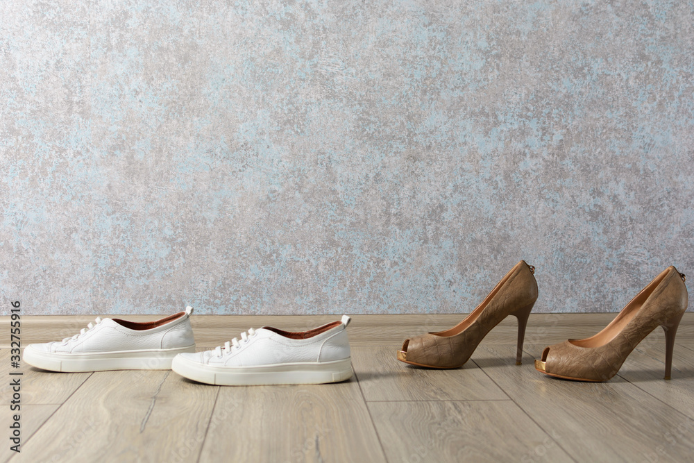 sneakers and shoes on a wooden background. Fashion, beauty and convenience.