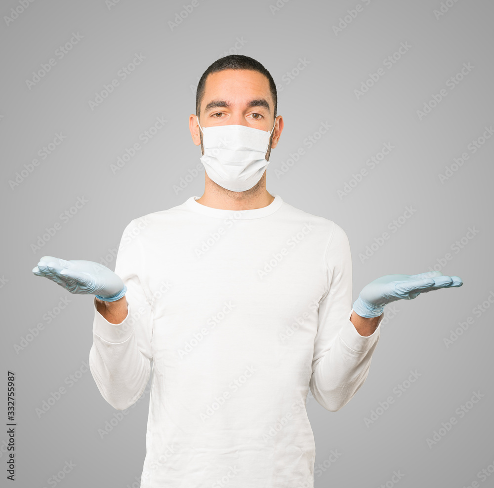 Coronavirus.Young man doing concepts and wearing mask and protective gloves