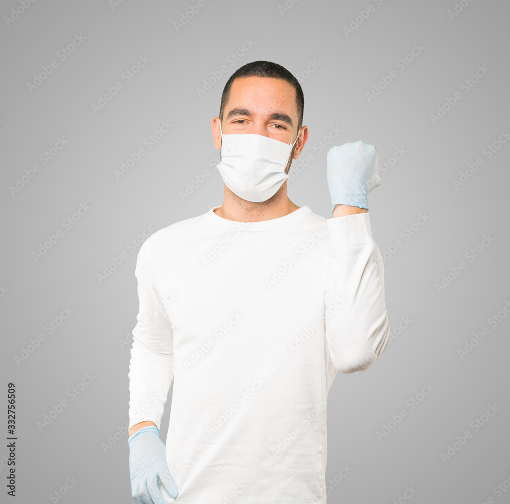 Coronavirus.Young man doing concepts and wearing mask and protective gloves