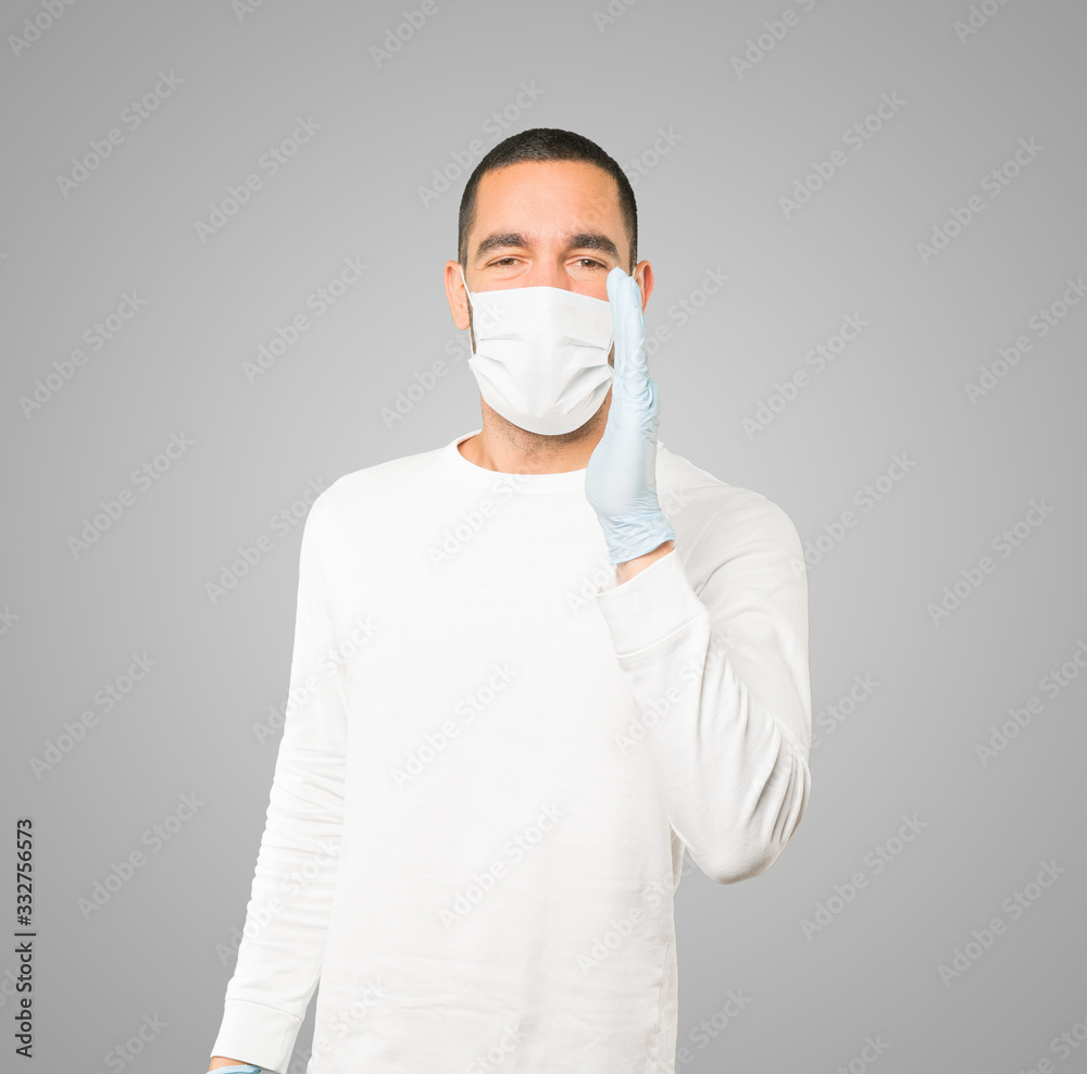 Coronavirus.Young man doing concepts and wearing mask and protective gloves Coronavirus.Young man doing concepts and wearing mask and protective gloves