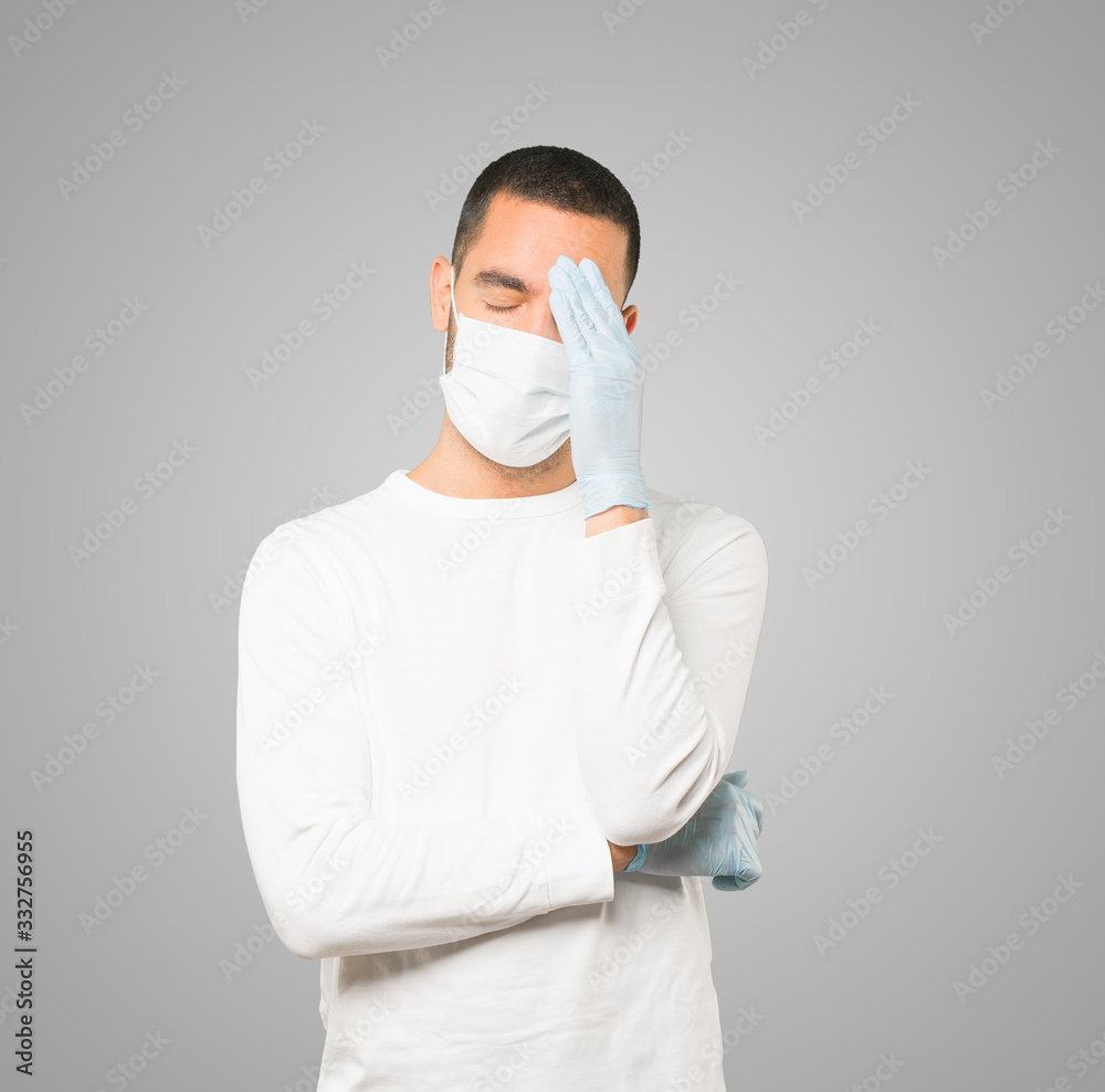 Coronavirus.Young man doing concepts and wearing mask and protective gloves Coronavirus.Young man doing concepts and wearing mask and protective gloves