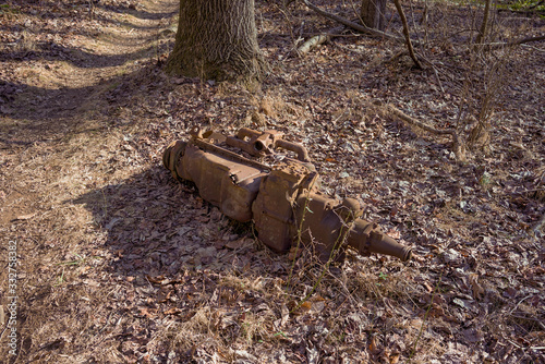 rusted transmission dumped in the woods