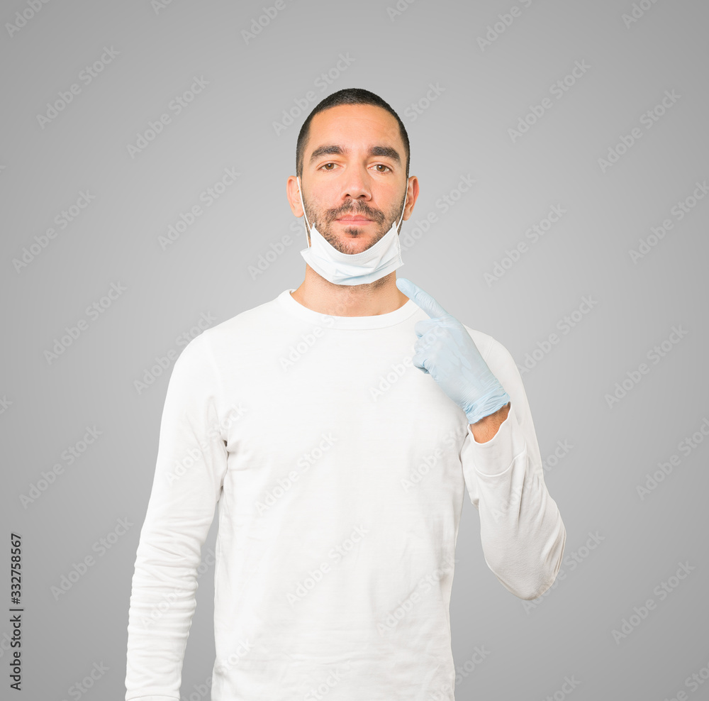 Coronavirus.Young man doing concepts and wearing mask and protective gloves Coronavirus.Young man doing concepts and wearing mask and protective gloves
