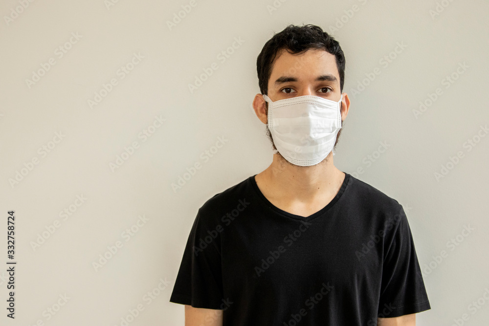 Man wearing protection face against coronavirus. Medical surgical mask. Novel coronavirus. (2019-nCoV). Covid-19. Man wearing protection face against coronavirus. Medical surgical mask. Novel coronavirus. (2019-nCoV). Covid-19.