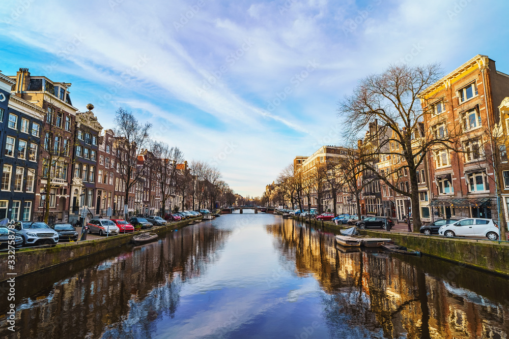 Beautiful view of Amsterdam canal at spring day. Amsterdam is capital of Netherlands. Old town.