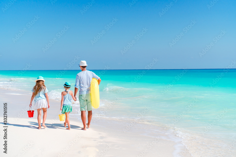 Happy beautiful family on a tropical beach vacation