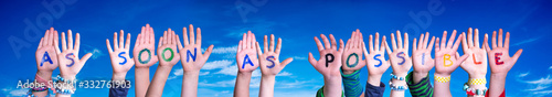 Children Hands Building Colorful English Word As Soon As Possible. Blue Sky As Background