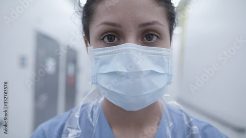 Corona virus pandemic in Sweden. Nurse with mask in slow motion. photo