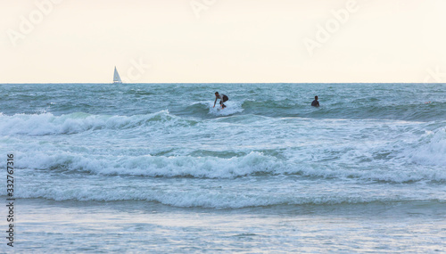 Surfer rides the waves of the Mediterranean Sea