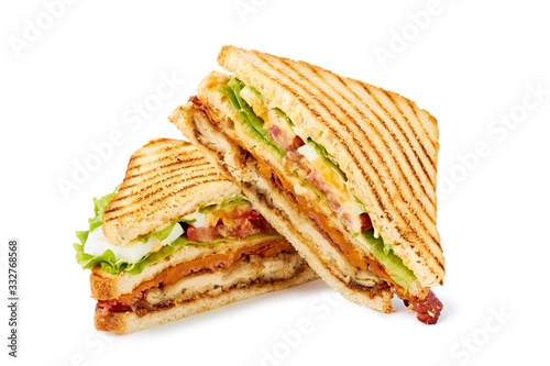 Two halves of club sandwich on white photo