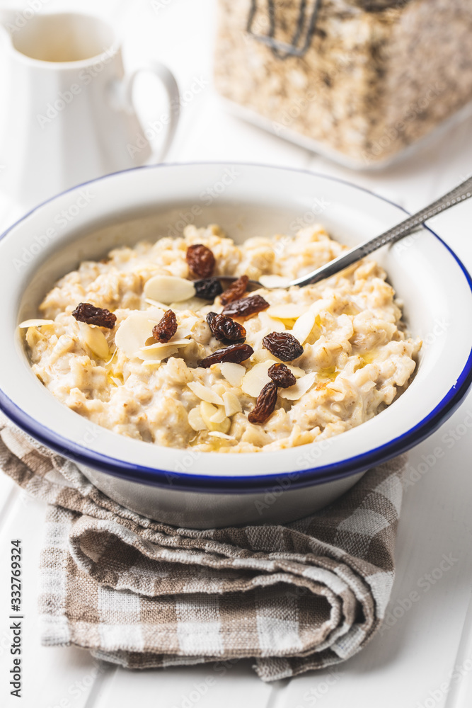 Bowl of oatmeal porridge with raisins Bowl of oatmeal porridge with raisins