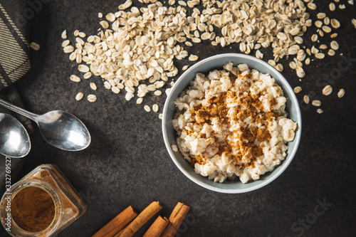 Bowl of oatmeal porridge with cinnamon.