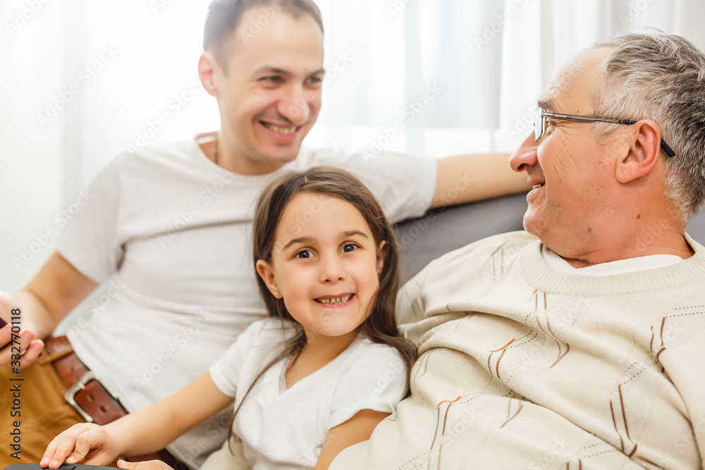 father, son and granddaughter at home father, son and granddaughter at home