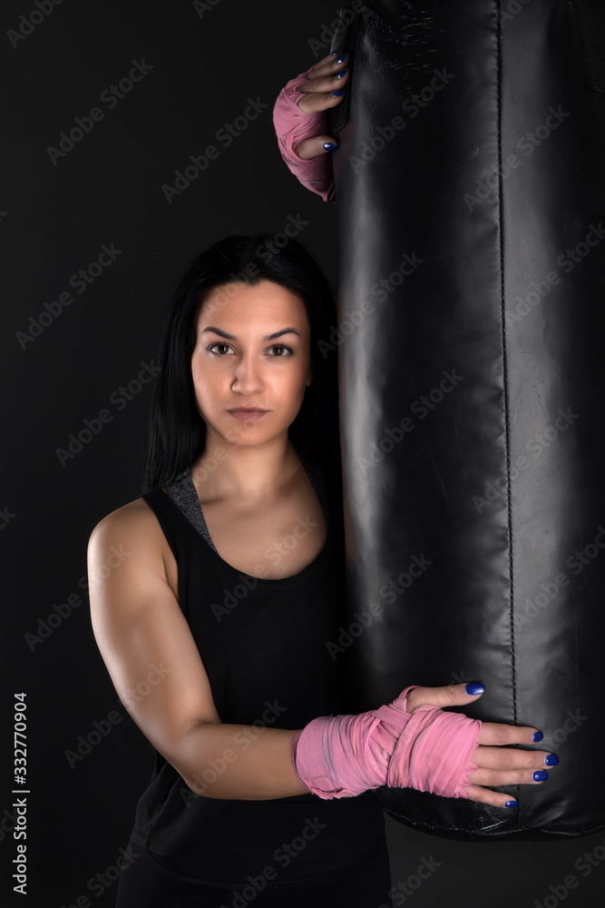 sexy girl training in the gym engaged in boxing