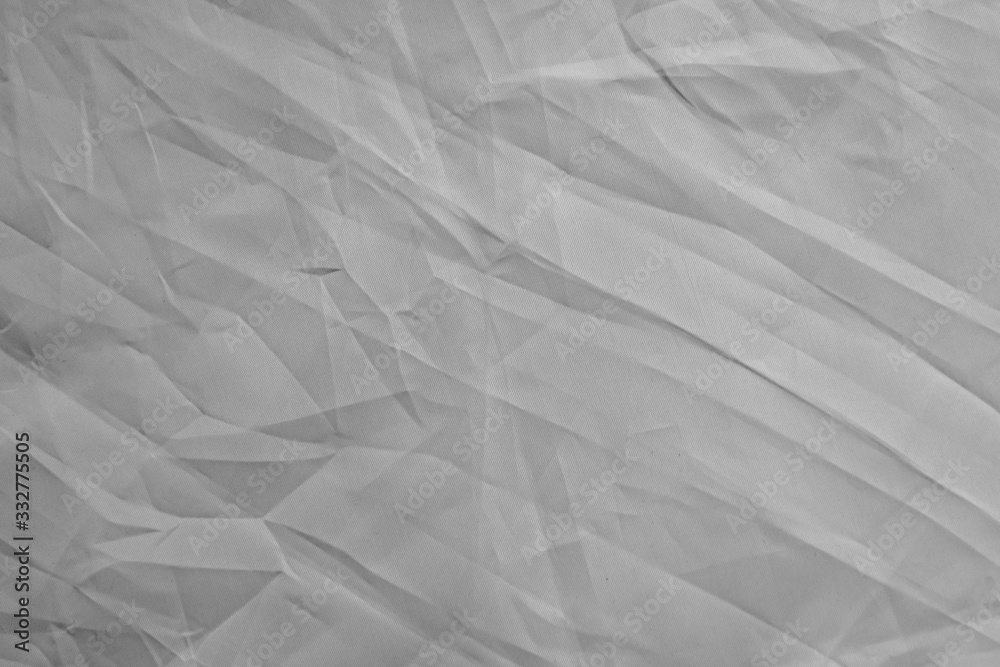 Fototapeta premium light background: Crumpled fabric, black and white, enhanced contrast