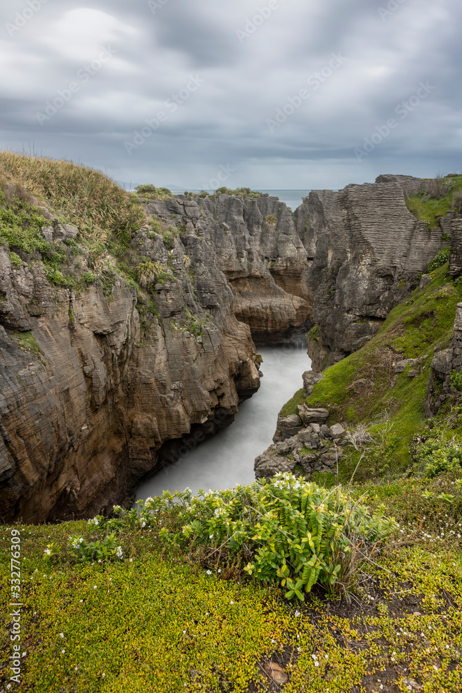 Blowhole view seen from the walktrack at Pancake rocks, New Zealand. Blowhole view seen from the walktrack at Pancake rocks, New Zealand.
