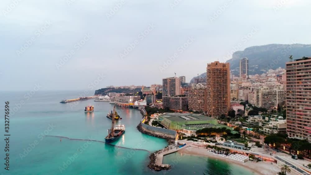 Establishing aerial view of Monaco Monte Carlo skyline and Monaco harbor French Riviera Cote d'Azur sea coastline on a beautiful sunny day during summer