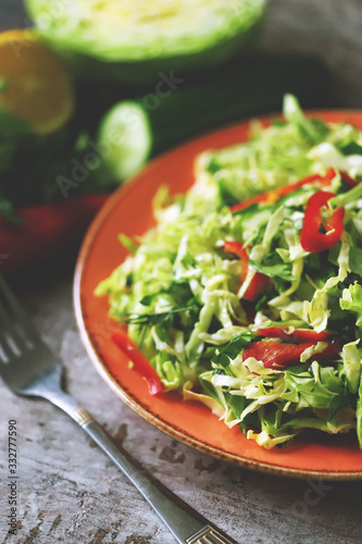 Healthy vitamin salad with fresh cabbage. Spring salad with cabbage and herbs. Healthy diet. Immunity diet.