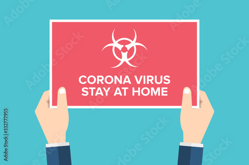 Corona virus alert, stay at home. Hands holding placard, sign. COVID-19.