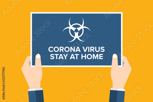 Corona virus alert, stay at home. Hands holding placard, sign. COVID-19.