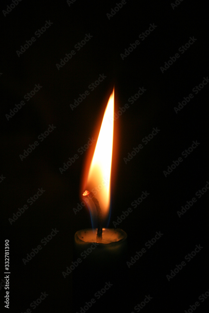 Flame of a candle burning in the dark Flame of a candle burning in the dark