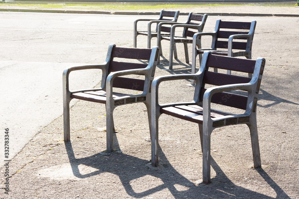 Empty chairs in the morning sunlight. City Park. Barcelona, Spain. Empty chairs in the morning sunlight. City Park. Barcelona, Spain.