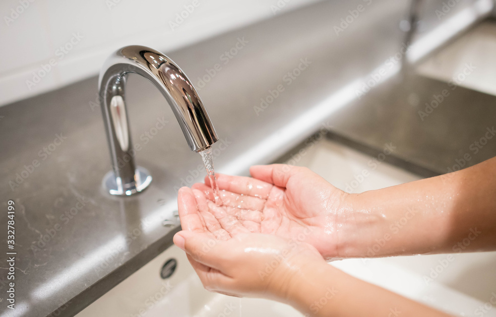Woman washing hand with soap and running water for coronavirus protection, Woman washing hand with soap and running water for coronavirus protection,