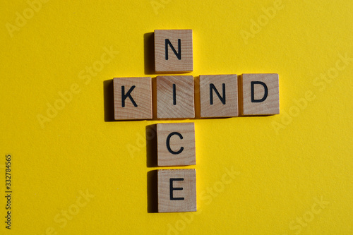 Nice and Kind, words in crossword form isolation yellow photo