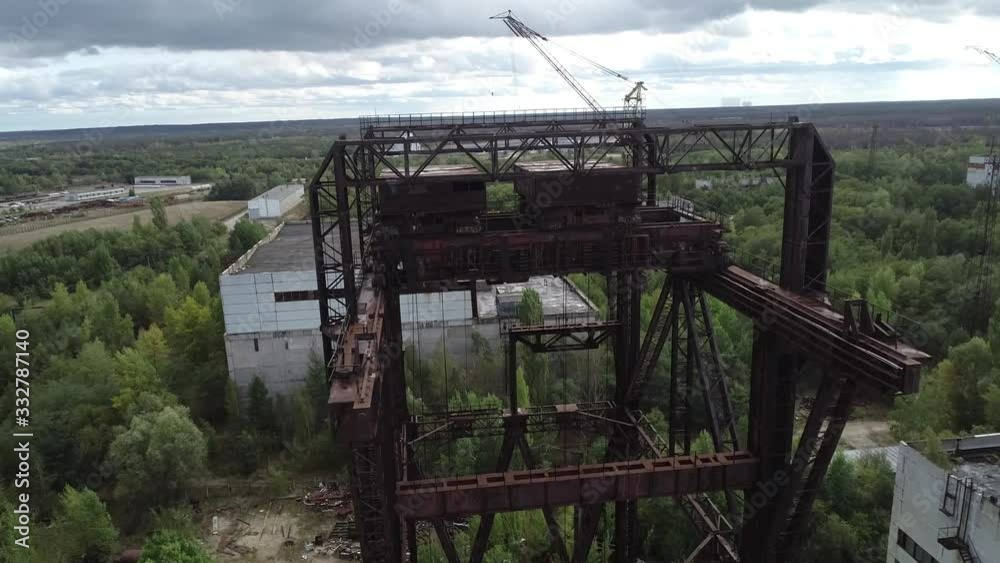 KP-640 crane. They load the reactors in the power units. Rusty tap. Near the city of Pripyat. Video from the drone. Unfinished 5th power unit of the Chernobyl nuclear power plant. Rare footage. Destru KP-640 crane. They load the reactors in the power units. Rusty tap. Near the city of Pripyat. Video from the drone. Unfinished 5th power unit of the Chernobyl nuclear power plant. Rare footage. Destru