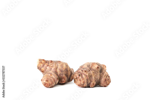Jerusalem artichoke on white background, isolated. The concept of eating and using unusual plants for food.