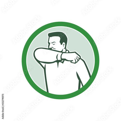 Icon retro style illustration of a man sneezing or coughing into crook of elbow to prevent the fluids and virus infection from spreading set inside circle on isolated white background.