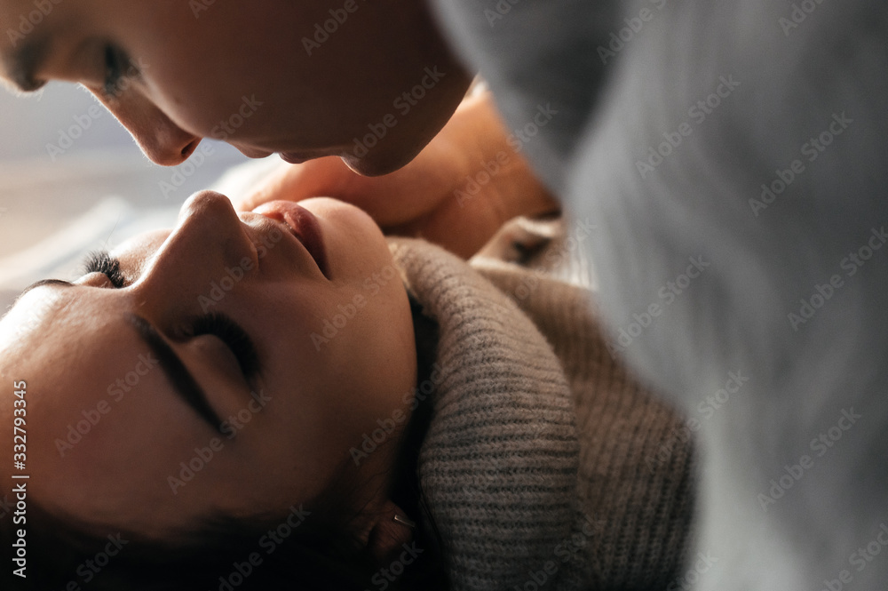 Close-up photo of a couple in love. They bask with each other. Close-up