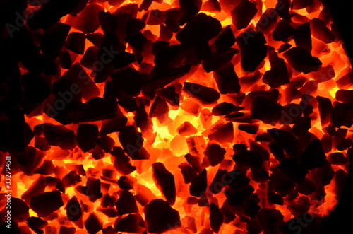 The background consists of burning coal anthracite with different intensities.