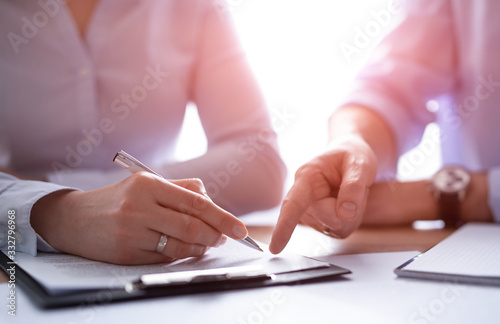 Business people negotiating a contract.