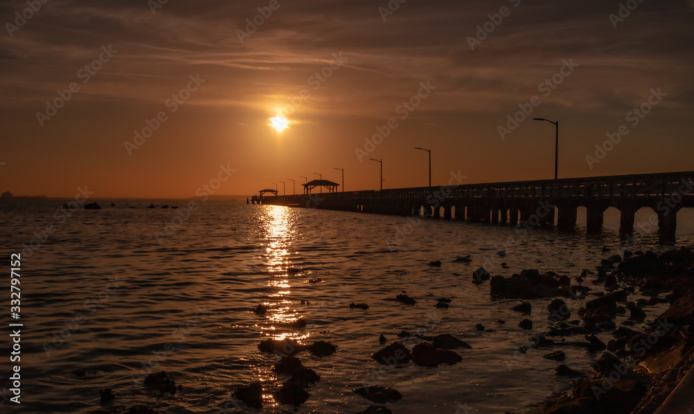 The Pier, early morning sun reflecting on the water The Pier, early morning sun reflecting on the water