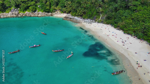 Aerial view of long tail boats along a tropical beach  Thailand