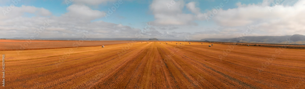 Amazing aerial view of beautiful hay bales on a meadow in autumn Amazing aerial view of beautiful hay bales on a meadow in autumn