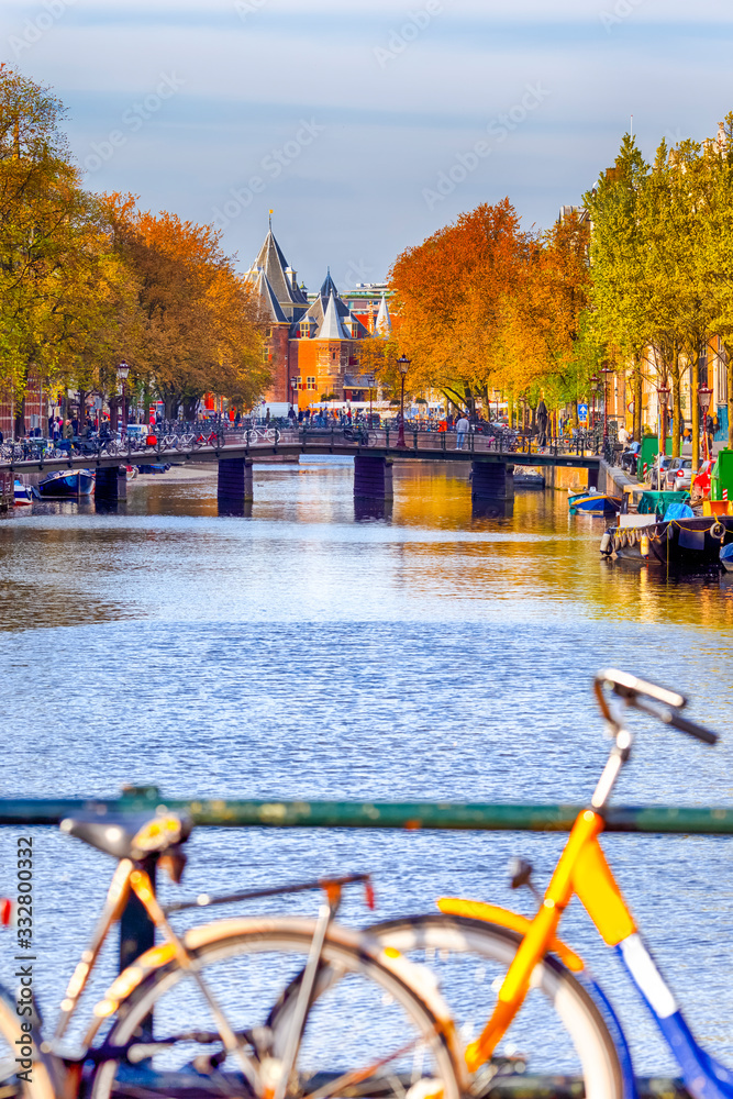 Traveling In the Netherlands. City of Amsterdam. Traditional Colorful Bicycles Along the Canal of Amsterdam.