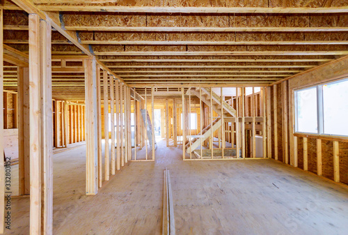 Slika na platnu Building construction, wood framing new home under construction roof being built