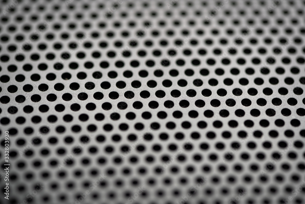 Black metal texture with round holes. Industrial background. Black metal texture with round holes. Industrial background.