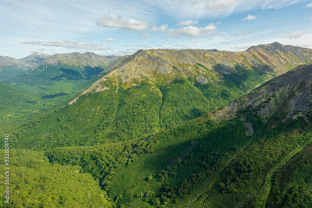 Obraz premium aerial view of Kamchatka volcanos, green valleys, snow and ice and the wonderful view of pure nature.