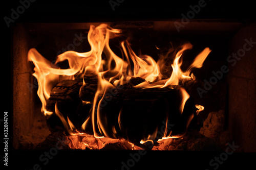 Burning wood in fire place.